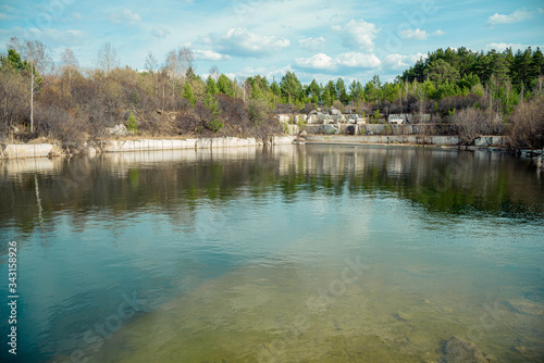 Flooded marble quarry in spring