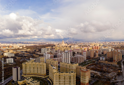 industrial views of a big city at sunset filmed from a drone