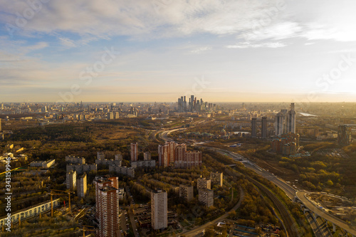 panoramic view with skyscrapers and highways of a big city filmed from a drone