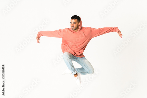 Man dancing street dance style over isolated white background