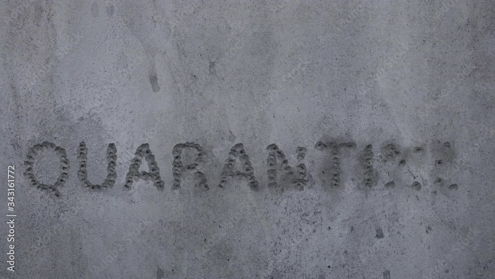 Bullet hits in a concrete wall, spelling out the word Bullet hits in a concrete wall, spelling out the word