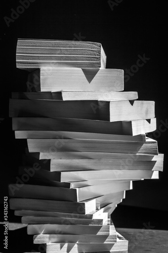 swirl of stack of books in black and white closeup
