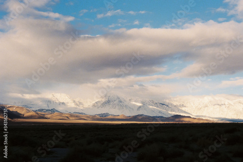 Light beams thru storm clouds over eastern Sierra Nevada mountains