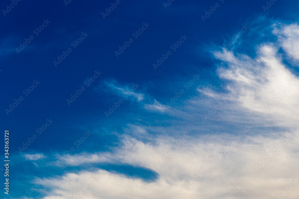 Beautiful blue sky with Cirrus Cumulus clouds. Panorama of the clear blue sky for your design. Sky background in Sunny weather. Beautiful blue sky with Cirrus Cumulus clouds. Panorama of the clear blue sky for your design. Sky background in Sunny weather.