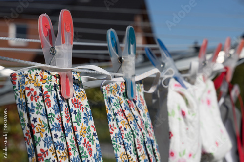 handmade face mask on clothes line to wear in corona crisis