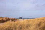 couple walking in coastal landscape 