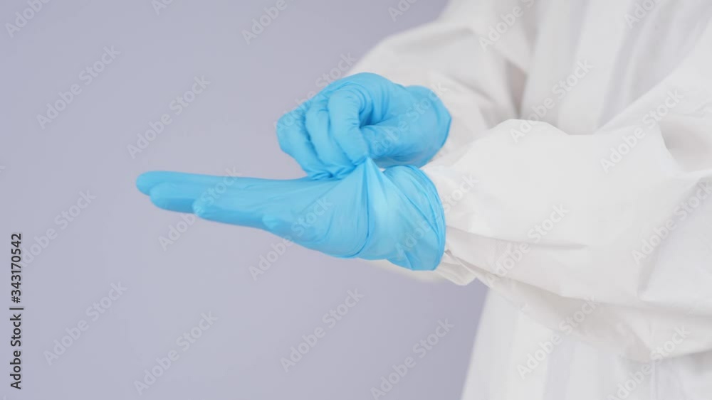 The doctor is wearing PPE personal protective equipment and gloves in operation room. prevent covid19 coronavirus, medical concept.