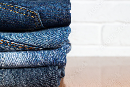 a stack of denim clothes closeup. place for text