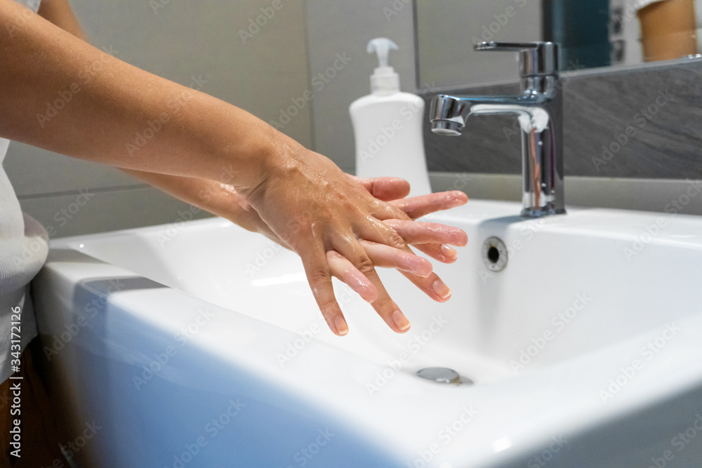Fototapeta premium Washing hands rubbing with soap woman for corona virus prevention, hygiene to stop spreading coronavirus