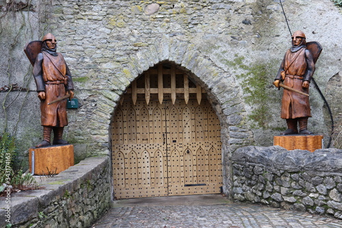 wooden gate and wooden statues