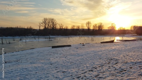 Sunset over the river  winter