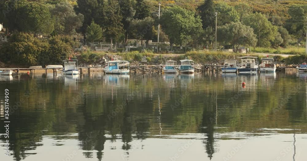 Small fishing boats on mediterranean sea coastline Small fishing boats on mediterranean sea coastline