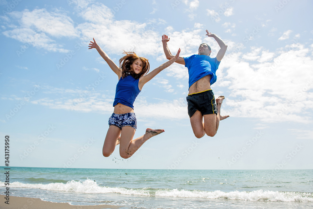 Young happy couple on seashore Young happy couple on seashore