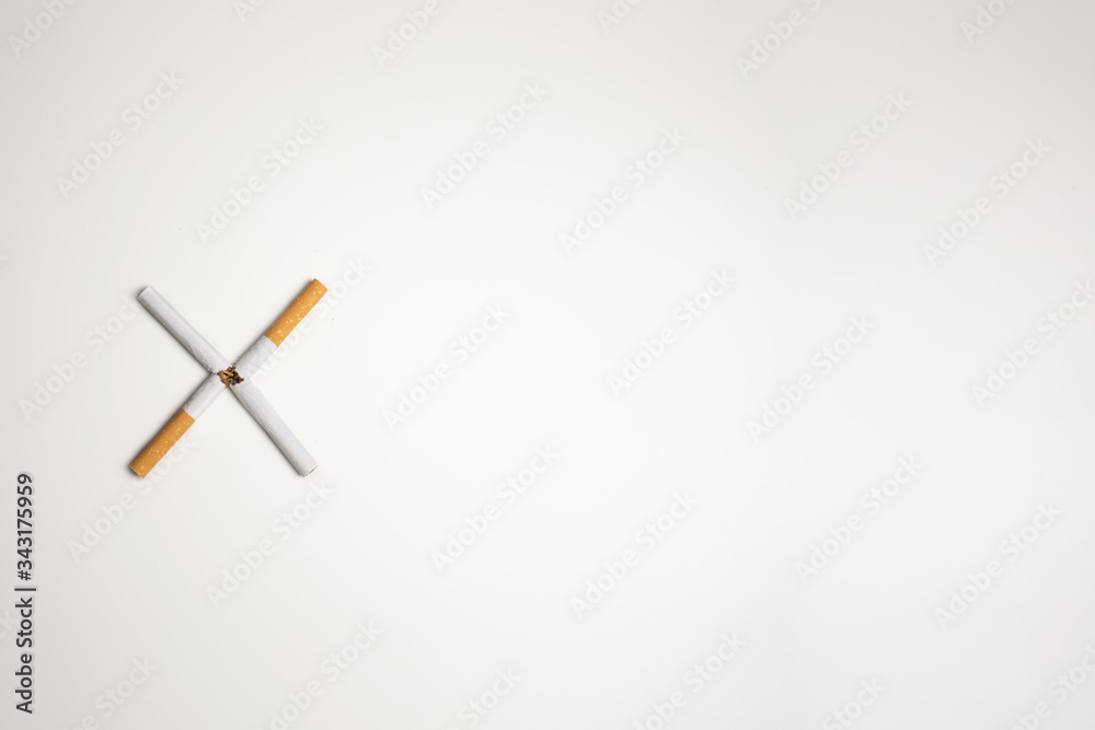 Cigars on white background making an x to quit smoking Cigars on white background making an x to quit smoking