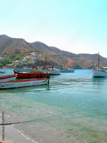 Tranquility by the fisher boats in the little village of Taganga in Colombia. Beautiful shore by the Caribbean coast line.