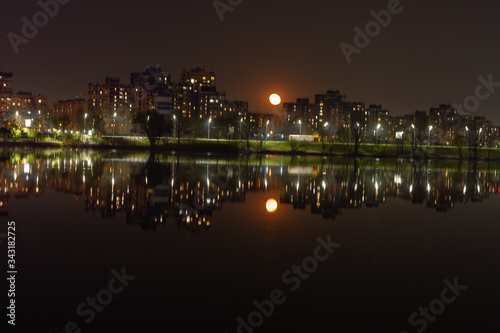 Night city Kiev is reflected in the water.