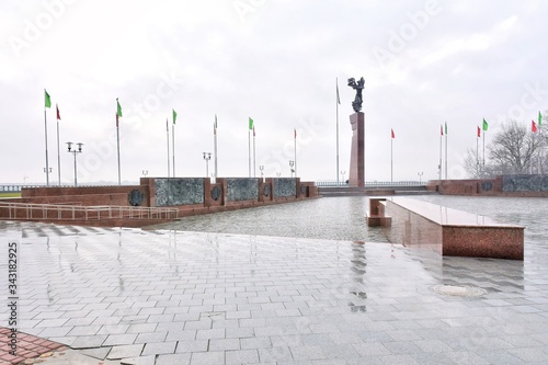 Mogilev, Belarus - March 2020. Memorial complex "Fighters for Soviet Power" in Mogilev. Central square with victory obelisk and eternal flame. Town hall. Mogilev landmark, cultural heritage. 