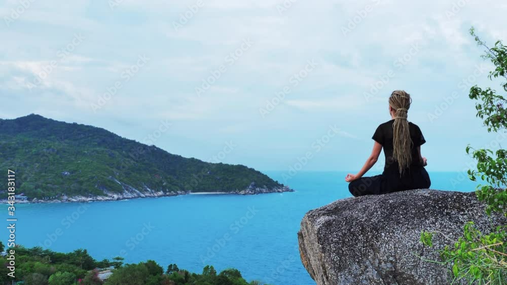 Serenity and yoga practicing by the sea with island view, meditation Serenity and yoga practicing by the sea with island view, meditation