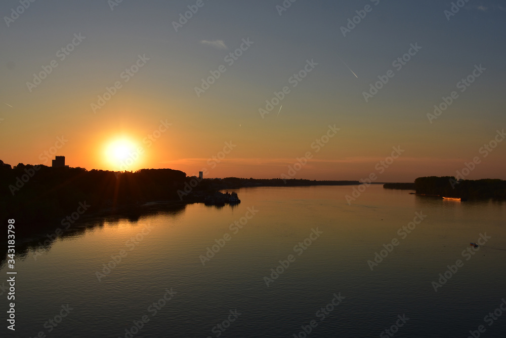 Sunset orange over the Danube River. Romantic atmosphere
