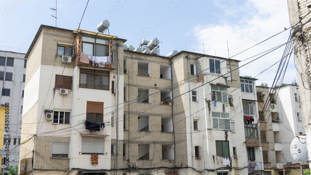 Tirana, Albania – June 7, 2019: View of the old building in Tirana city center on a blue sky.