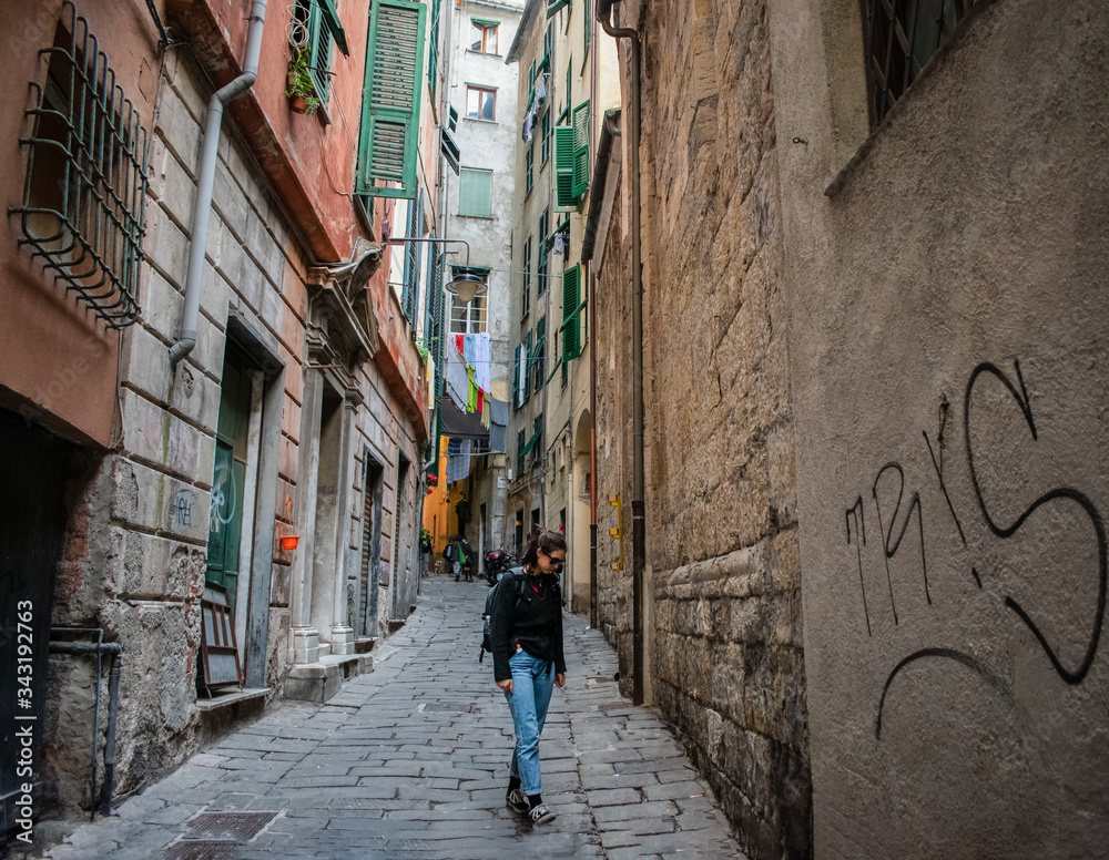 young woman walking in the city in genoa