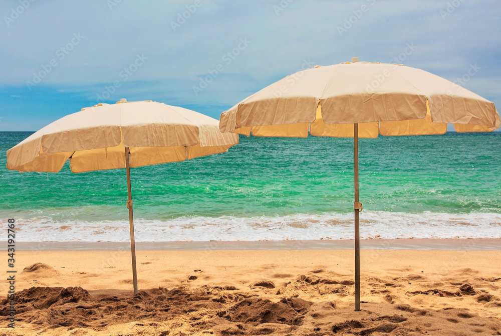 Idyllic beach with white sand and beach umbrellas. Portugal