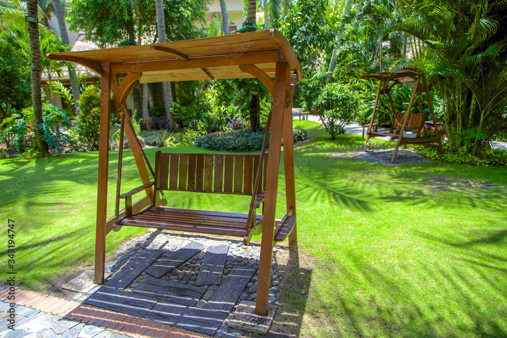 wooden swing in the garden, mui ne, Vietnam.
