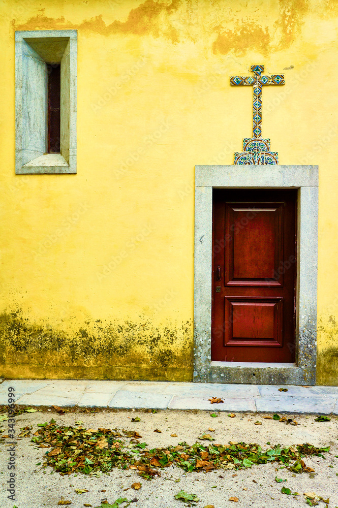 Yellow church with red door in Sintra Portugal