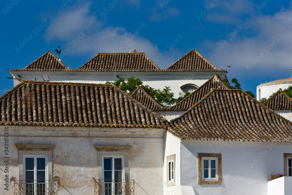 Typical four-sided roofs, characteristic of the region and of oriental origin in Tavira, Algarve, Portugal Typical four-sided roofs, characteristic of the region and of oriental origin in Tavira, Algarve, Portugal