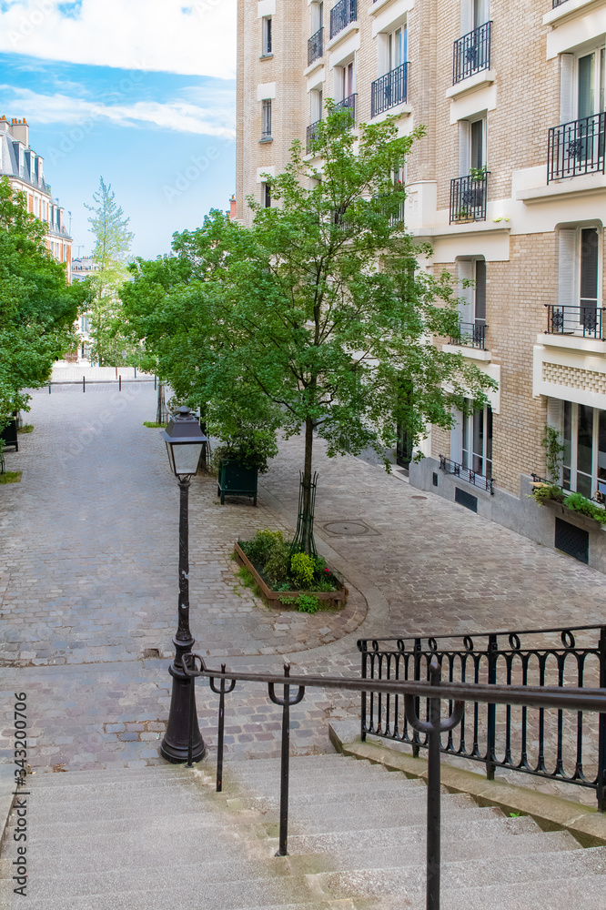 Fototapeta premium Paris, Montmartre, typical buildings and staircase, romantic view 