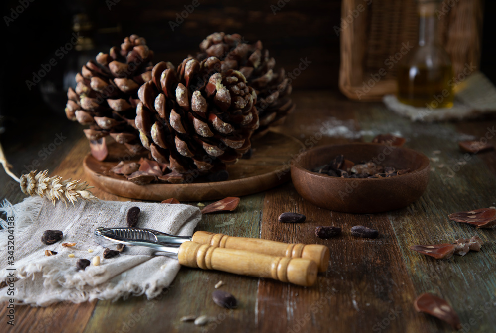 Cedar cones on a rustic wooden table
Cedar cones on a rustic wooden table