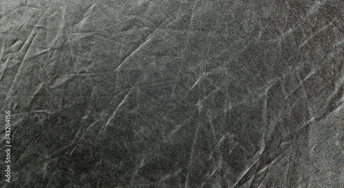 Wrinkled rich black silver fabric. Texture background for design