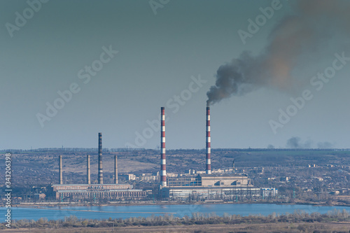 Industrial landscape with smoke from pipes
