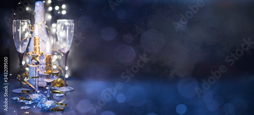 New years eve celebration background with champagne, Christmas and New Year holidays background, winter season.