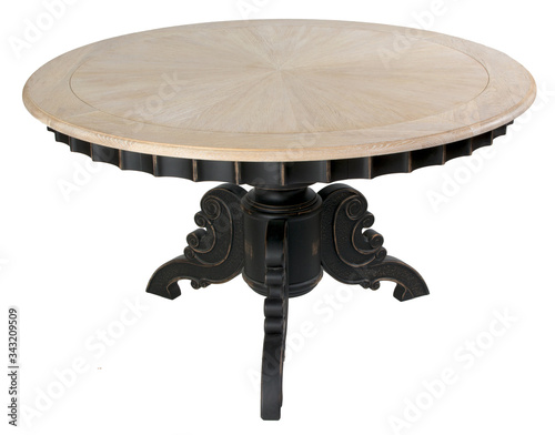 
Round wooden table on the central leg photo