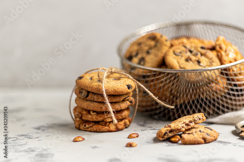 Chocolate Chip Cookies. Homemade baking. Round shape, not big. On a light gray background. photo