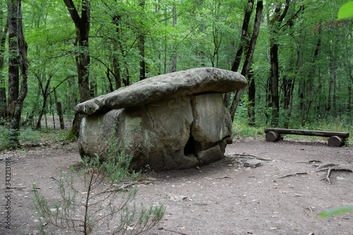 Dolmen in Shapsug. Forest in the city near the village of Shapsugskaya, sights are dolmens and ruins of ancient civilization. photo