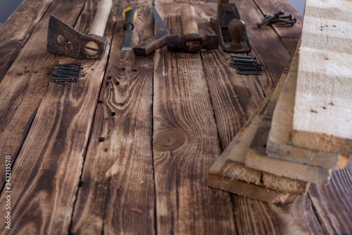 Collection of woodworking tools on a wooden background