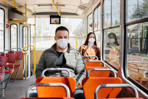 Passengers on public transport during the coronavirus pandemic keep their distance from each other. Protection and prevention covid 19