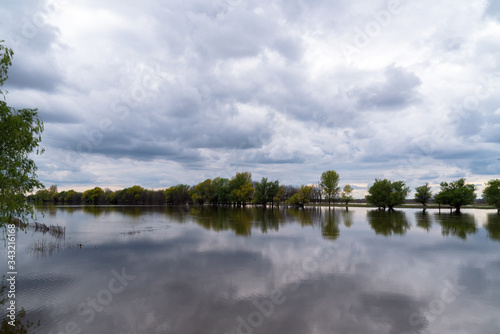 Fototapeta Naklejka Na Ścianę i Meble -  A river that overflowed its banks.Spring flood