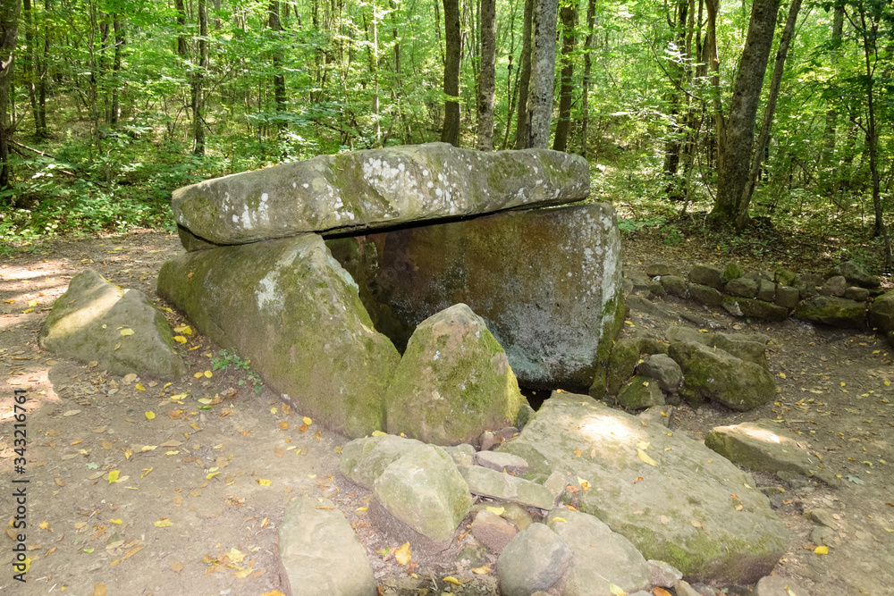 Dolmen in Shapsug. Forest in the city near the village of Shapsugskaya, sights are dolmens and ruins of ancient civilization. Dolmen in Shapsug. Forest in the city near the village of Shapsugskaya, sights are dolmens and ruins of ancient civilization.