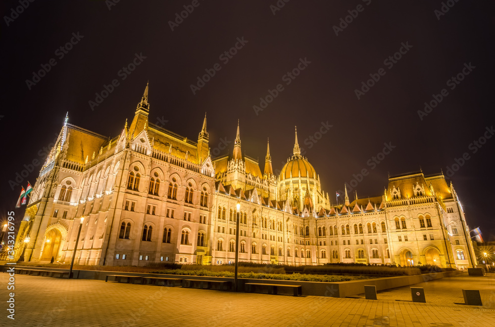 Night view of the Hungarian Parliament Building in Budapest, Hungary.