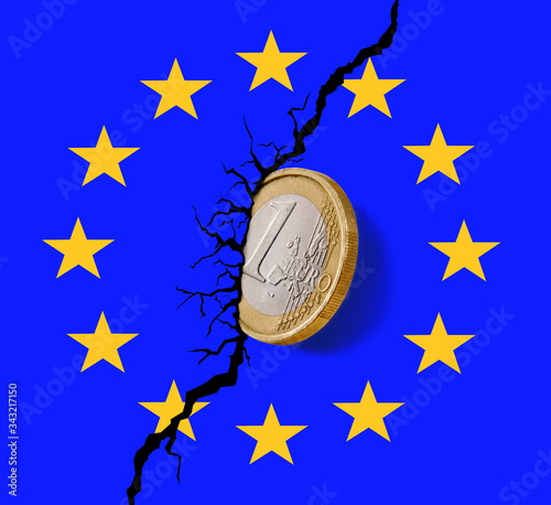 Fotografie Europe Union collapse economy on Euro coin embedded on logo wall and crack