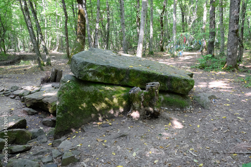 Dolmen in Shapsug. Forest in the city near the village of Shapsugskaya, sights are dolmens and ruins of ancient civilization. photo