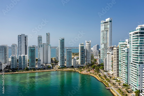 Aerial view of a skyline of white residential skyscrapers in Cartagena's prestigious Castillogrande district. © ronedya