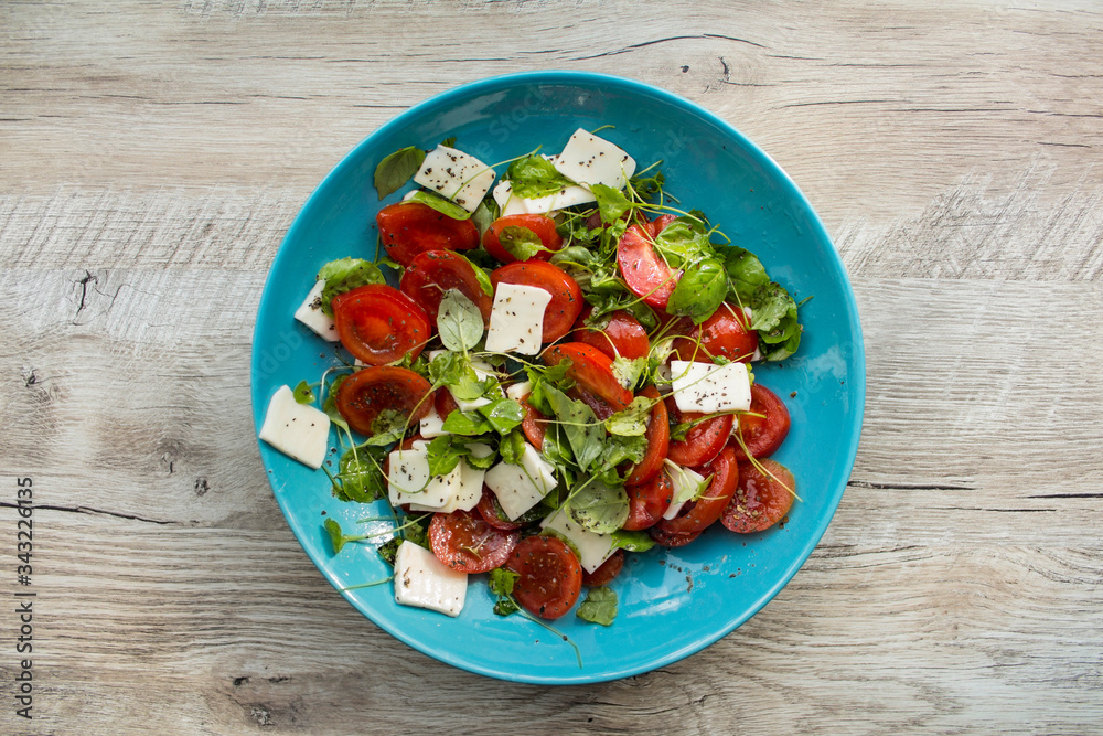 Salad with tomato, cheese and basil