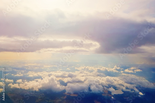 Blue sky clouds background. Beautiful landscape with clouds and orange sun on sky