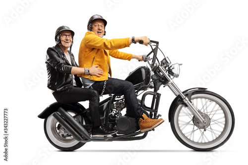 Elderly male friends on a chopper motorbike