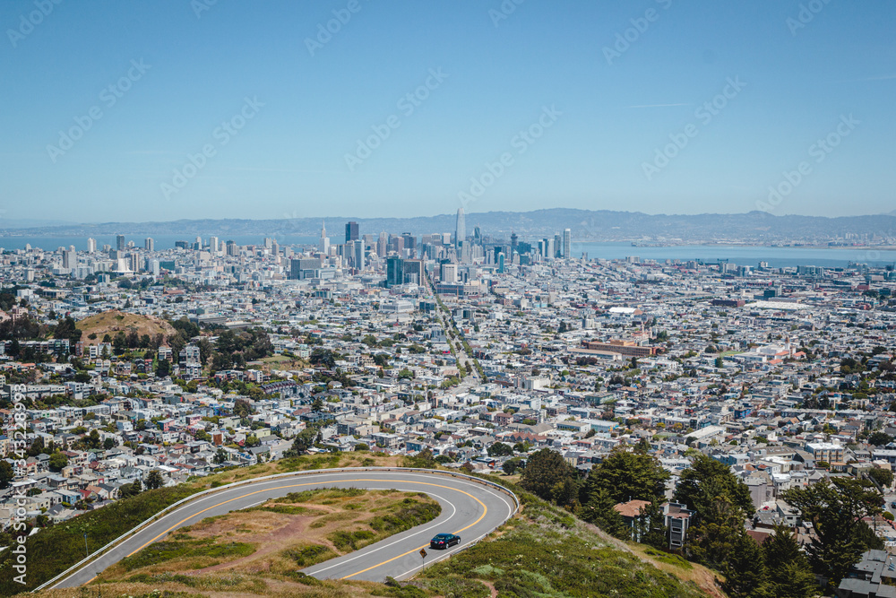 View on San Francisco city downtown and bay from famous touristic Twin Peaks hill. Beautiful scenery view on SF, California travel destination, Bay Area touristic spot, traveling in USA