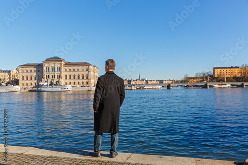 Photography Stockholm, a man looks at the architecture of the city